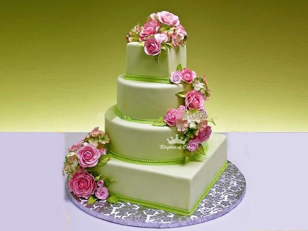 Cutting beautiful green sponge cake on festive background with bokeh light  Stock Photo - Alamy